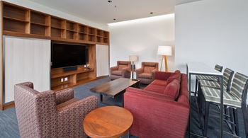 a living room filled with furniture and a television